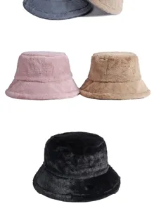 Detailed view of soft warm faux rabbit fur bucket hats in various colors for winter