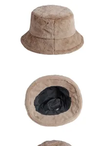 Detail view of faux rabbit fur bucket hat showing plush texture and black interior lining