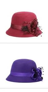 Elegant vintage wool-like cloche hat featuring floral ribbon and polka dot mesh veil.