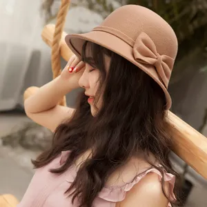 Elegant camel brown woolen felt cloche hat with a stylish bow decoration for women