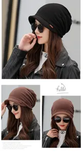 Close-up of a woman in black and brown beanies with soft brims and fashion labels