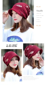 Detail views of wine red slouchy beanie hat with stylish golden feather patterns