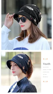 Detail views of black winter beanie hat with soft brim and golden feather pattern