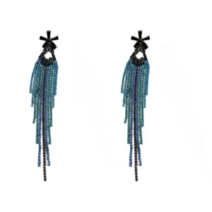 Detailed macro view of the long Klein blue and black rhinestone tassel earrings.