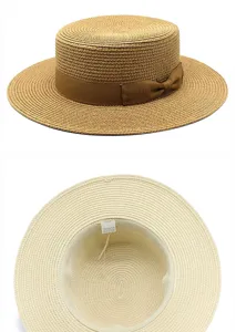 Vista dettagliata di un cappello di paglia da donna con fiocco e informazioni sull'etichetta