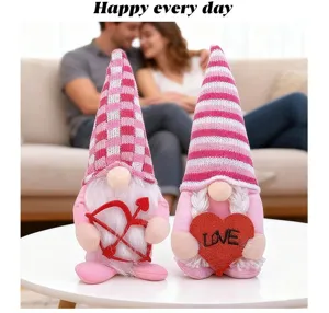 Close-up of pink Valentine's Day gnomes with Cupid bow and heart on white table