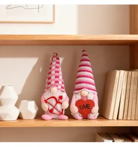 Detail view of pink Valentine's Day gnomes featuring a Cupid bow and a red LOVE heart