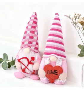Detailed view of Valentine's Day plush gnomes featuring Cupid bow and a red LOVE heart.
