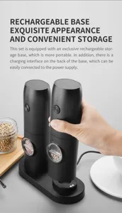 Close-up of electric pepper grinder set being placed on its sleek rechargeable storage base