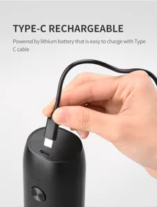 Close-up of the Type-C charging port on a black electric kitchen pepper grinder.