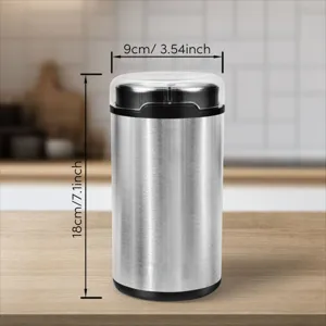Detail view of electric stainless steel coffee grinder showing height and width dimensions