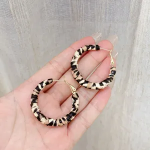 Vintage leopard print leather wrapped hoop earrings featuring gold-tone hardware detail