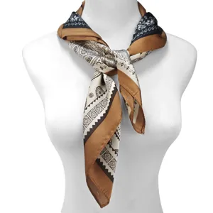 Elegant paisley printed silk scarf tied on a mannequin neck for a stylish look