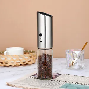 Detail view of a stainless steel electric pepper grinder with USB charging port