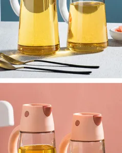 Detail of automatic opening pink lid on transparent glass oil dispenser bottle