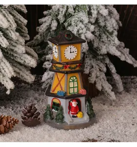 Close-up of resin Christmas clock tower with Santa Claus figurine in snow scene