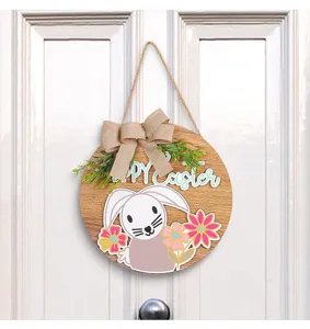 Close-up detail of a wooden Easter door hanger featuring a burlap bow and cute bunny design