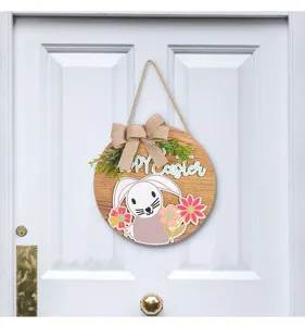 Detailed view of wooden Easter bunny door hanger with 'Happy Easter' and burlap bow