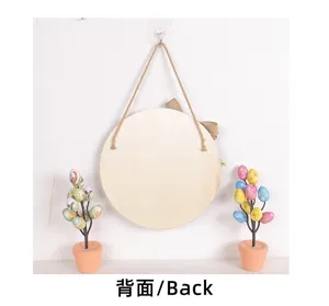 Back view of round Easter wooden plaque hanging with burlap bow and jute rope.