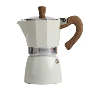 Elegant cream white stovetop moka pot with heat resistant wood grain handle and knob.