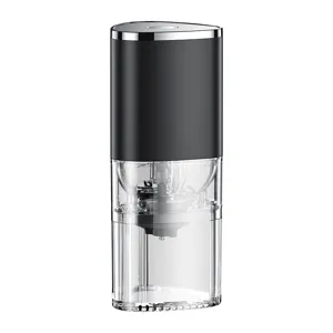 Modern portable electric coffee grinder with transparent chamber for home and office use