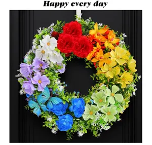 Vibrant colorful spring artificial flower wreath with butterflies hanging on black door