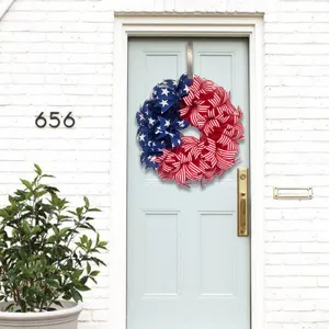 Detailed view of the patriotic Independence Day mesh wreath hanging on a front door