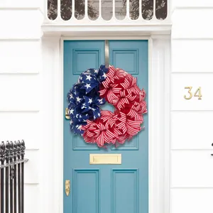 American flag patriotic wreath displayed on a blue residential door