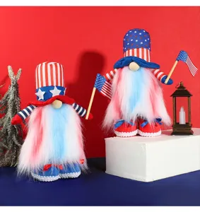 Pair of patriotic American Independence Day gnomes with LED lights holding small flags.