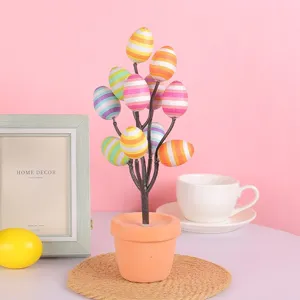 Decorative Easter egg bonsai tree with colorful striped eggs for desktop ornament