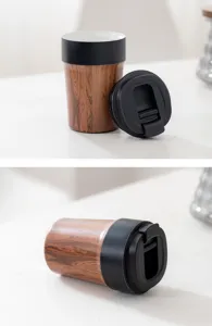 Detailed macro view of the wood-grain travel mug showing open and closed lid positions.