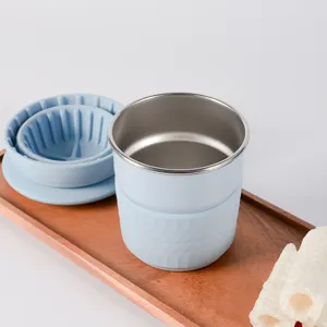 Portable travel pour-over coffee set with blue silicone filter and cup