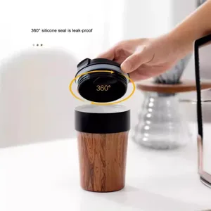Insulated wood grain coffee travel mug with a 360-degree leak-proof silicone seal lid