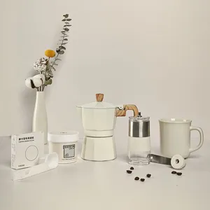 6-piece Moka pot and manual coffee grinder gift set in cream white with wood accents