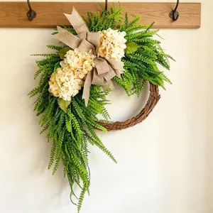 Farmhouse style hydrangea wreath with fern leaves and burlap bow for home decoration