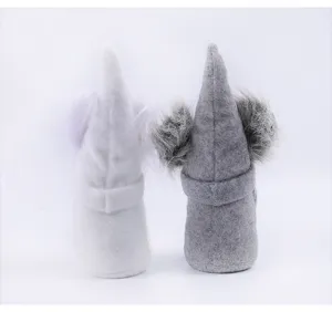 Detailed rear view showing texture of white and grey plush Easter bunny gnomes dolls