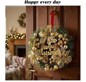 Elegant golden Christmas wreath with glitter poinsettias hanging on a wooden door detail.