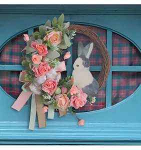 Charming Easter wreath with pink roses and rabbit on a rustic blue window frame decor