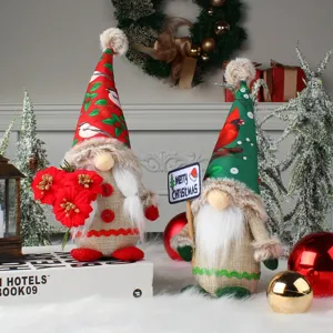 Handmade festive Christmas gnomes with printed hats for holiday home decoration