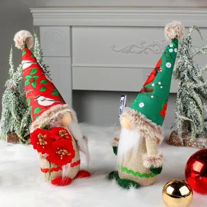 Pair of festive faceless Christmas gnome dolls with bird patterned hats and burlap bodies