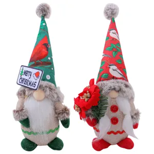 Pair of adorable Christmas gnomes with printed hats and festive holiday decorations