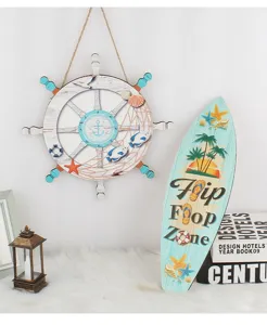 Close-up view of wooden nautical wall decor featuring a ship wheel and surfboard for beach homes.