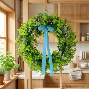 Lush green artificial leaf wreath with blue velvet ribbon for home wall decoration