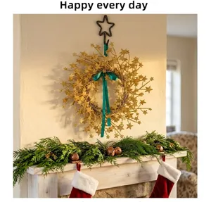 Golden glitter star wreath with green bow hanging above a festive fireplace mantle