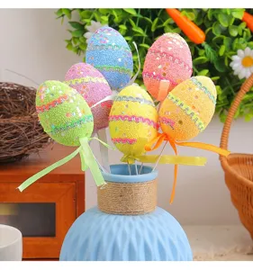 Decorative colorful foam Easter egg sticks with glitter and ribbons in a blue vase
