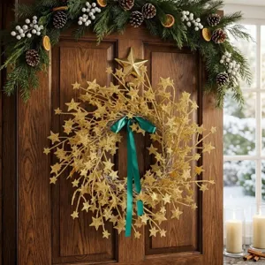 Golden glitter star holiday wreath with teal ribbon hanging on a festive wooden door
