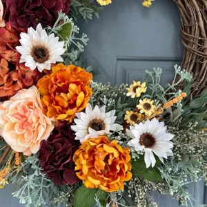Fall floral wreath with orange roses and white sunflowers for front door decoration