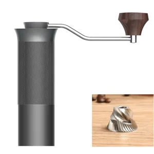 Detail view of a manual coffee grinder featuring a high-precision CNC stainless steel burr.