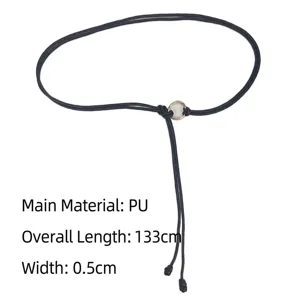 Detail of black PU knotted thin belt for dresses, 133cm length with golden ring buckle.