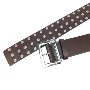 Fashionable dark brown leather belt for women featuring three rows of silver metal eyelets